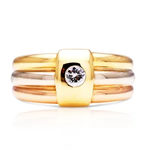 Cartier | a stylish 18ct rose, white and yellow gold diamond band, signed