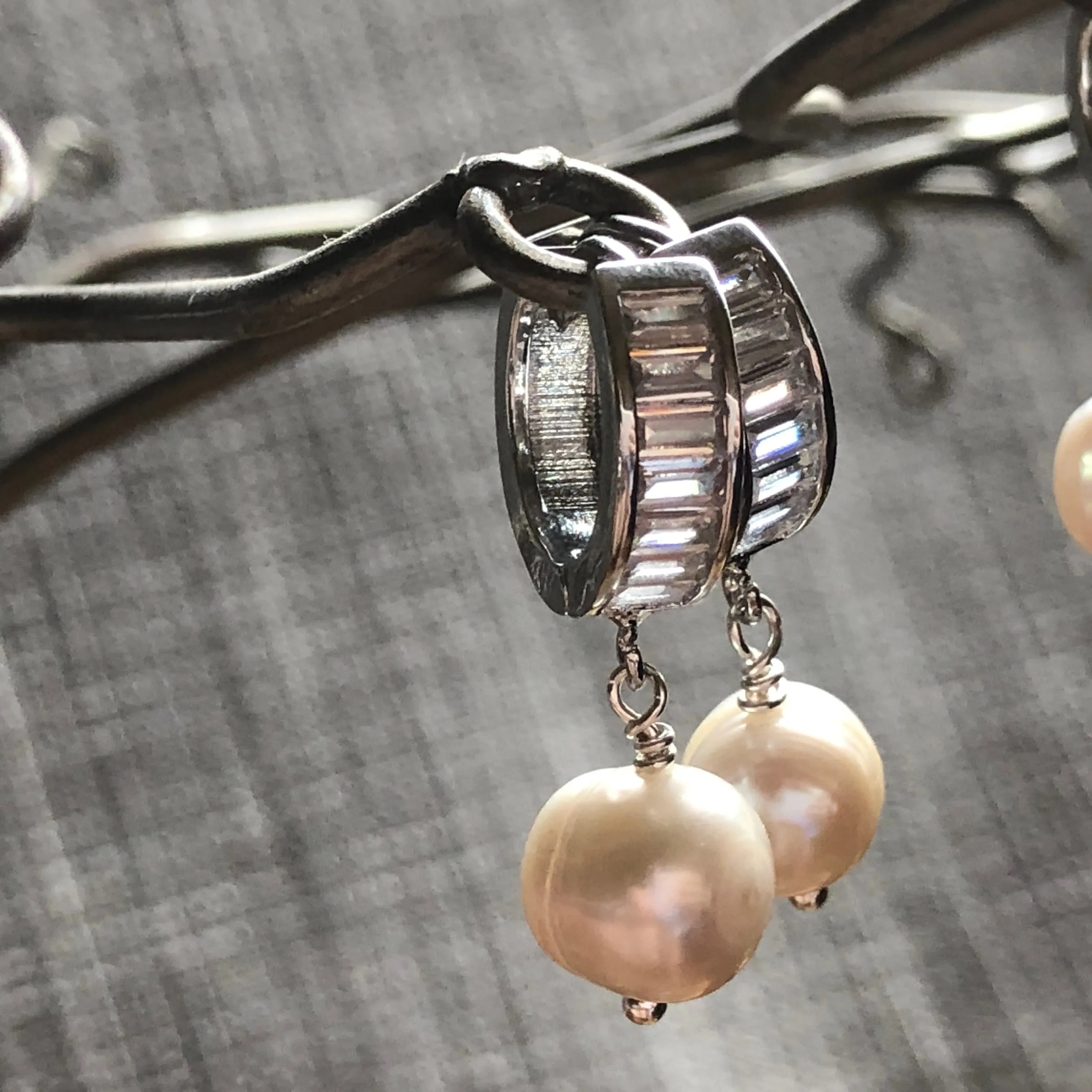Earrings: Large single Pearl drop earrings on a baguette encrusted hoop - classic