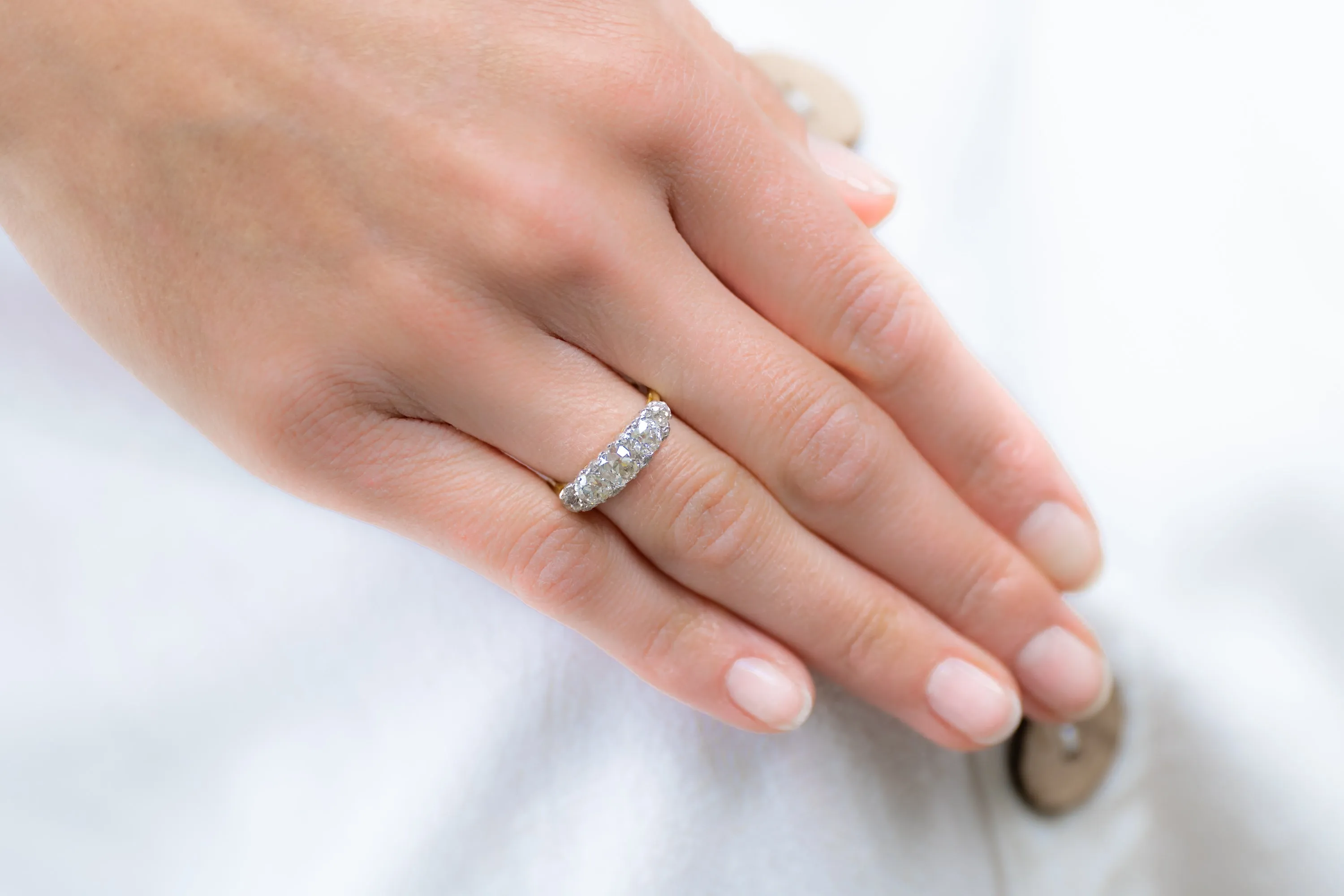 Edwardian, 18ct gold and platinum, old cushion-cut diamond five stone engagement ring