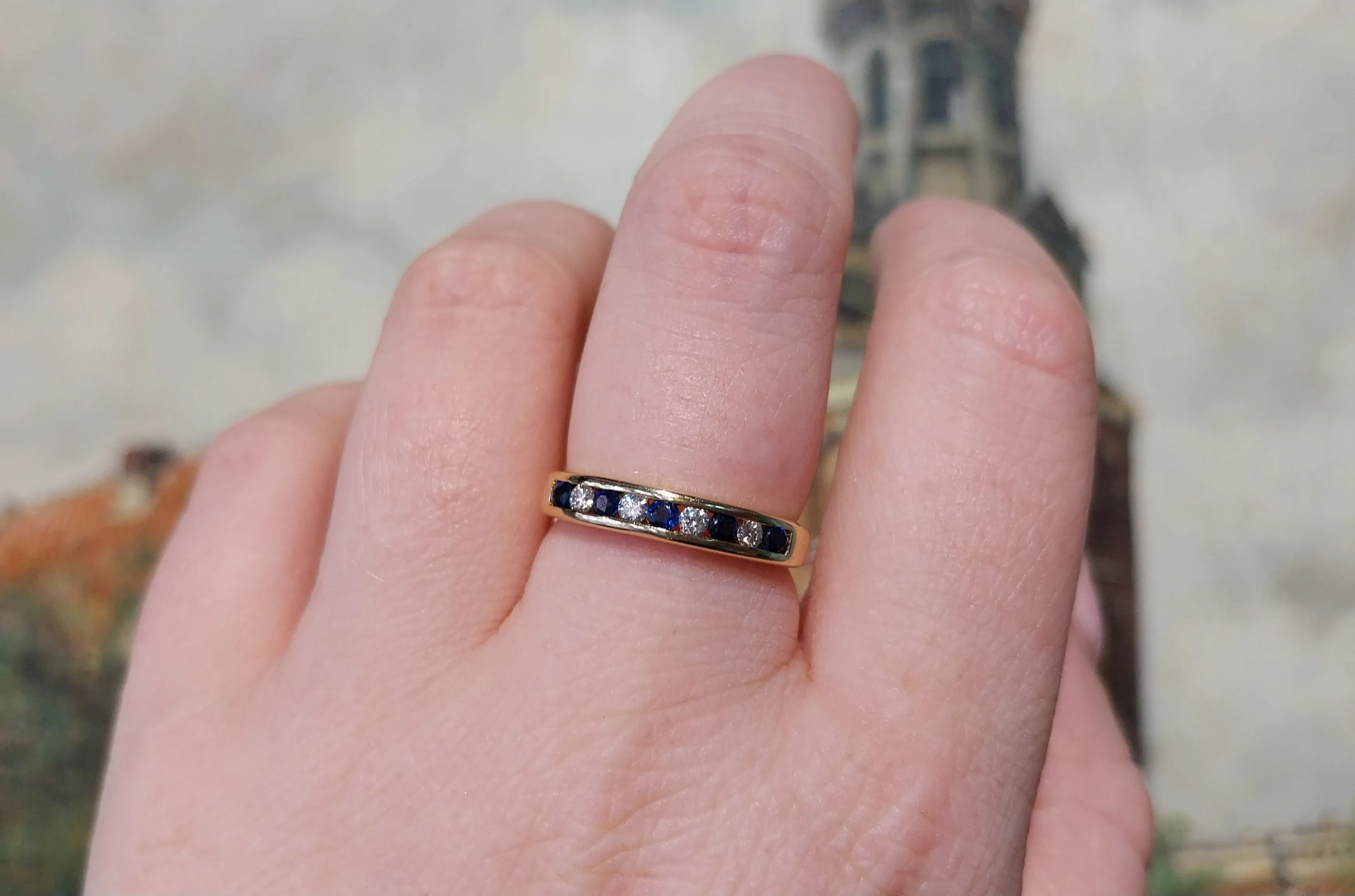 Sapphire and diamond band in 18 carat gold