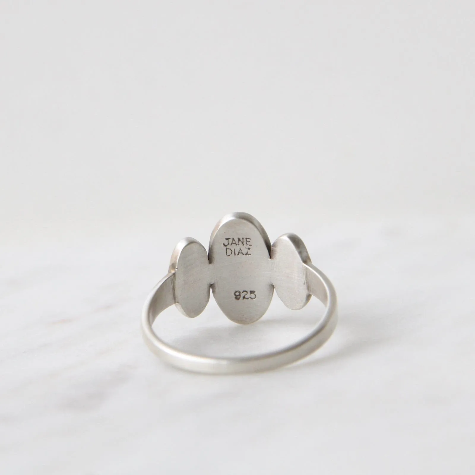 Three Ovals with Star Set CZ Ring